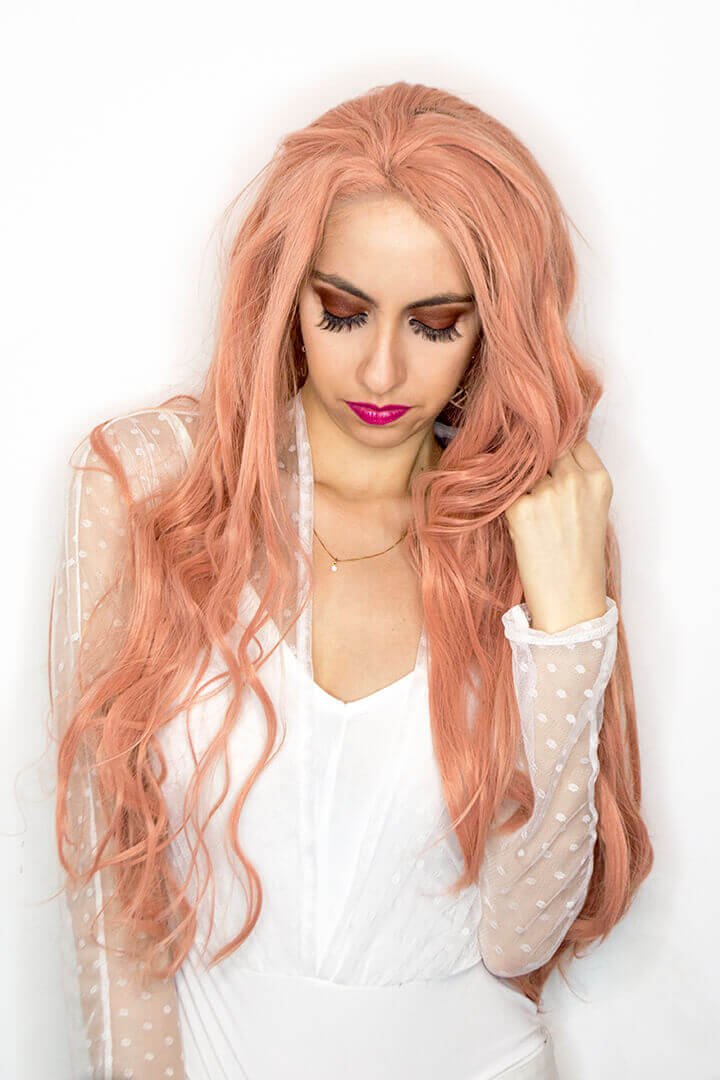 White bodysuit and pink hair