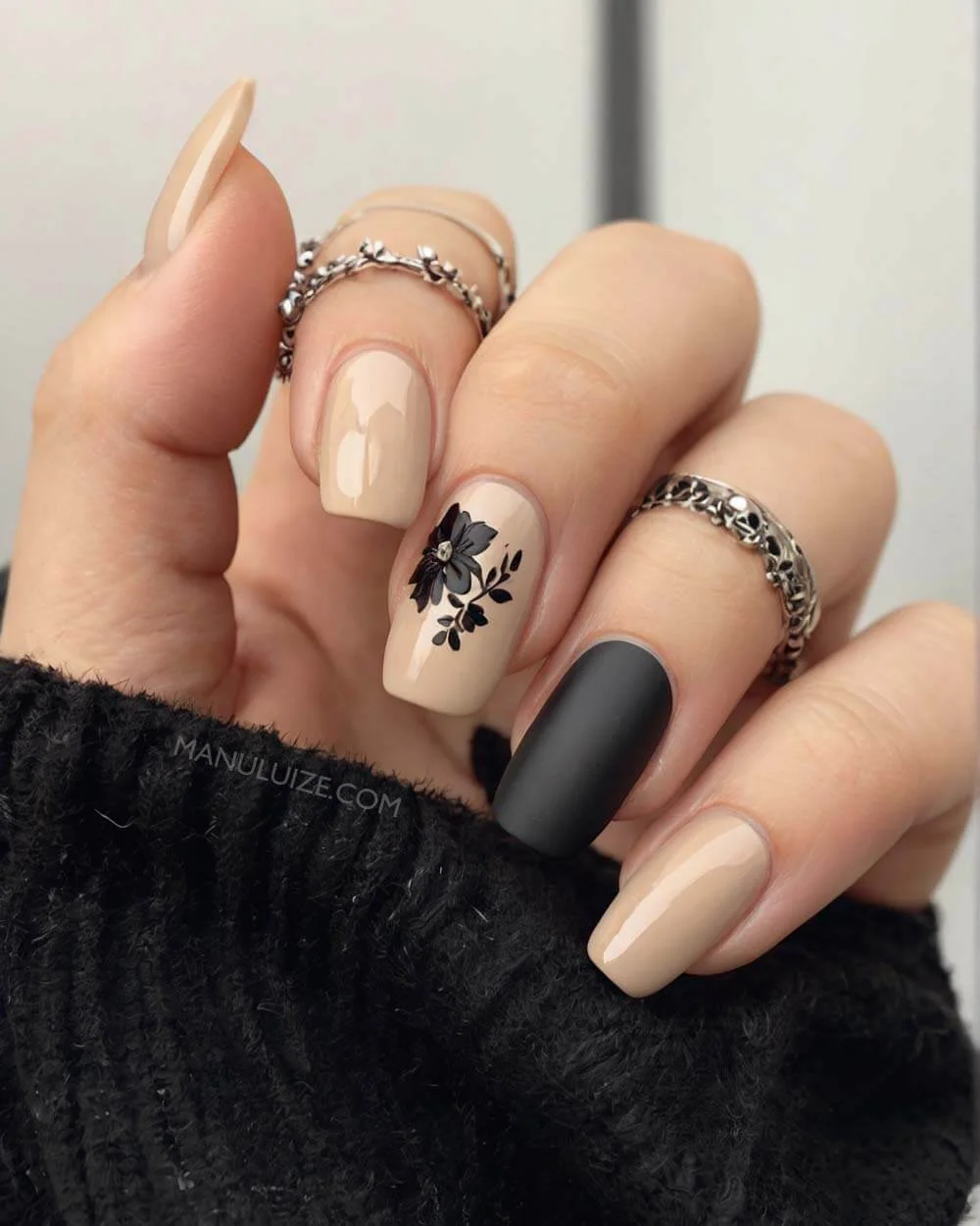 Black and nude flower nail design