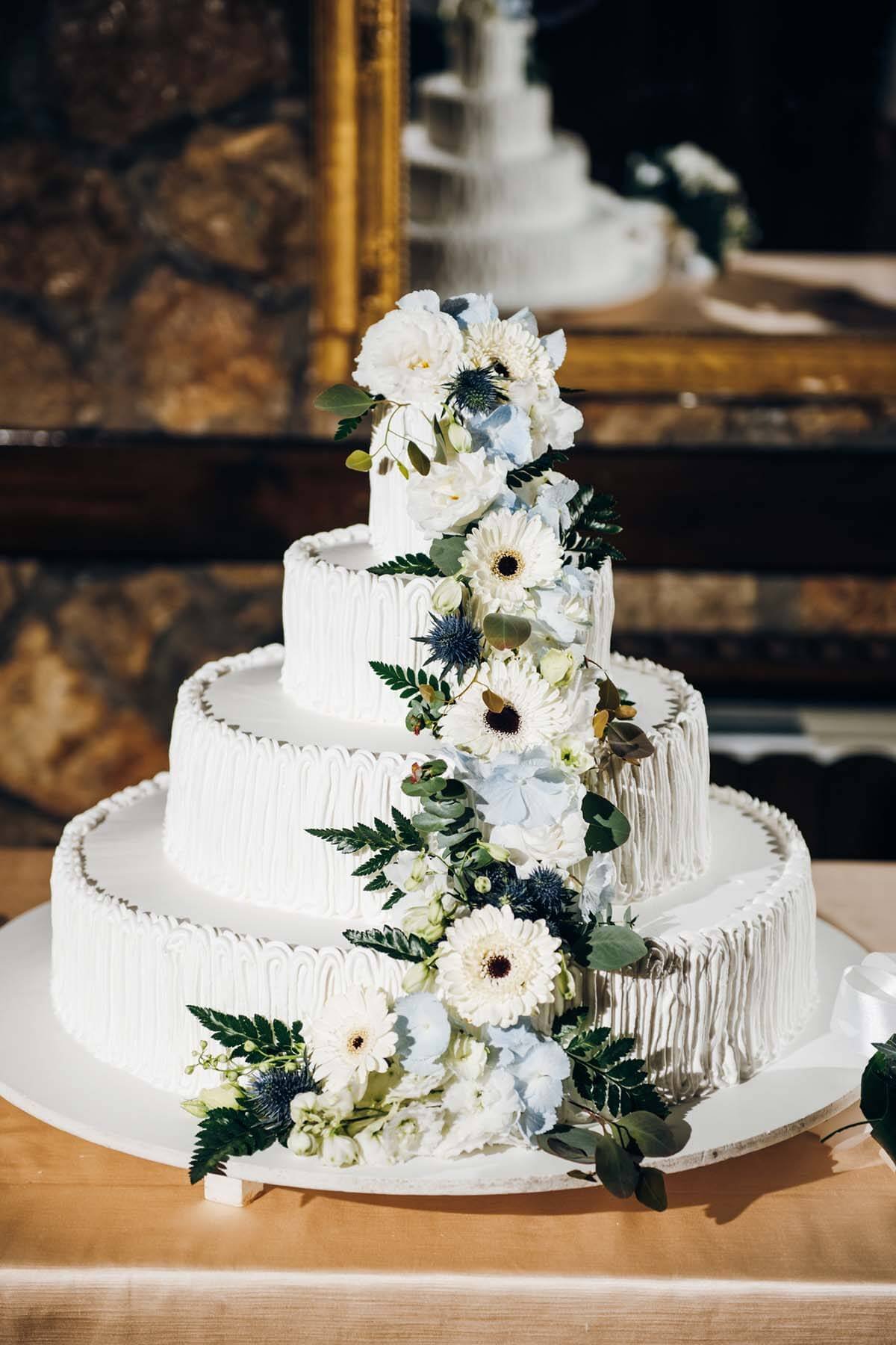 white sunflower wedding cake