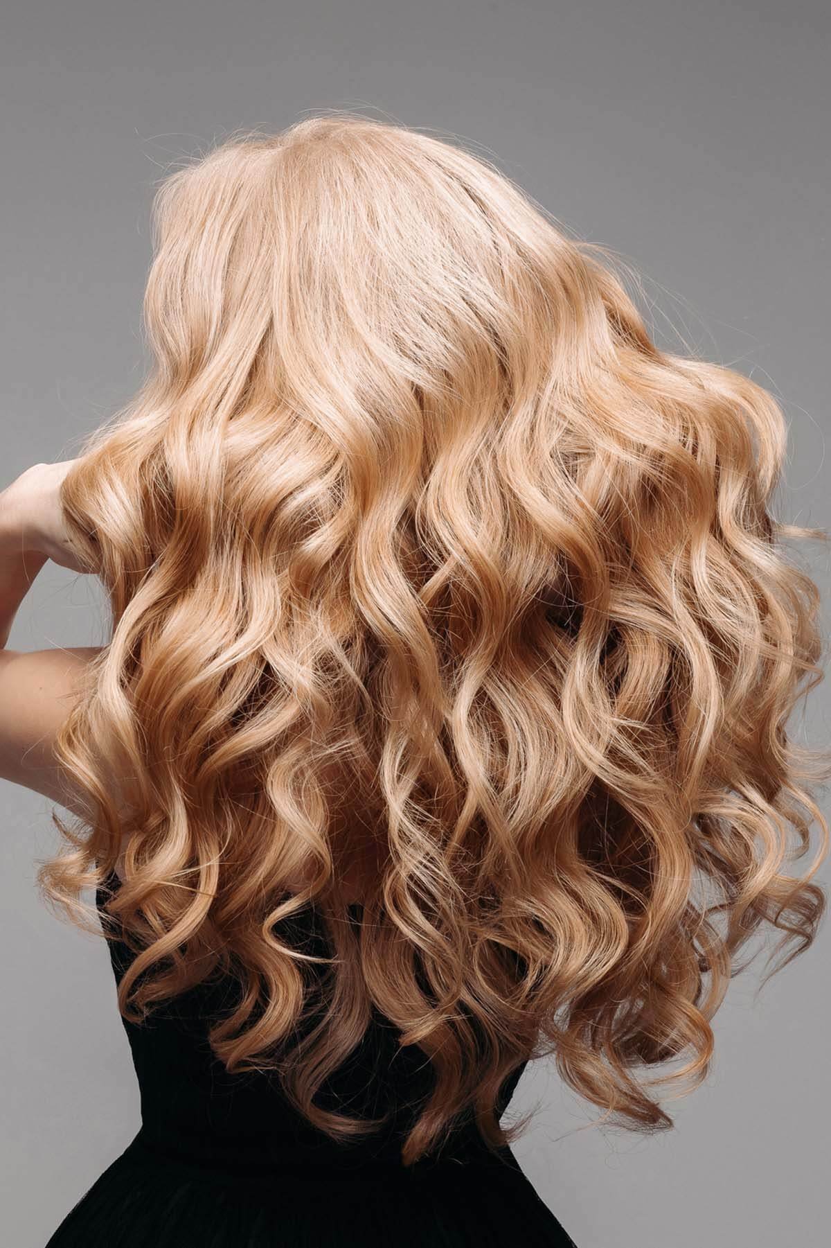 Warm blonde with long curls