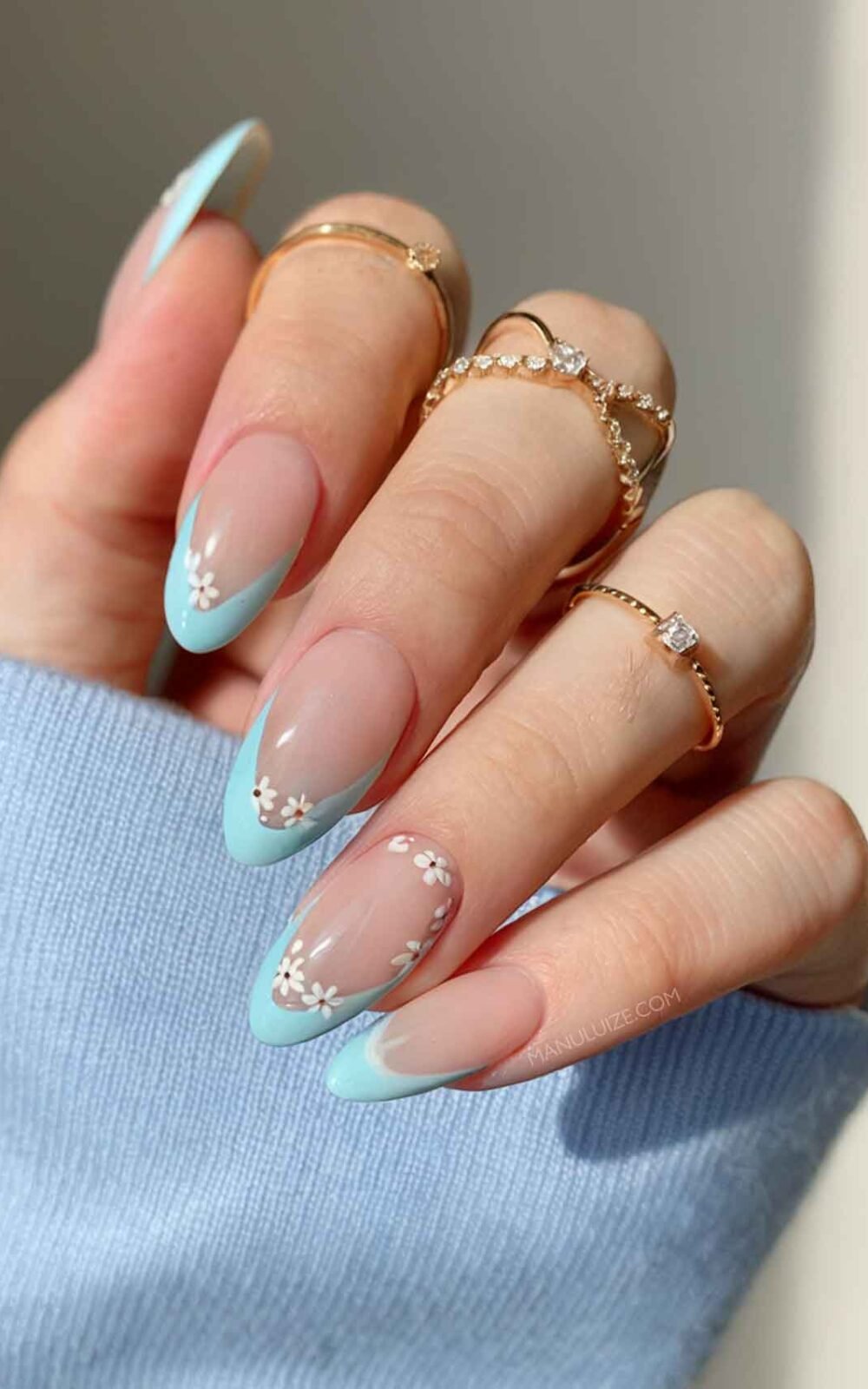 Baby blue nails with flowers Baby blue nails with flowers