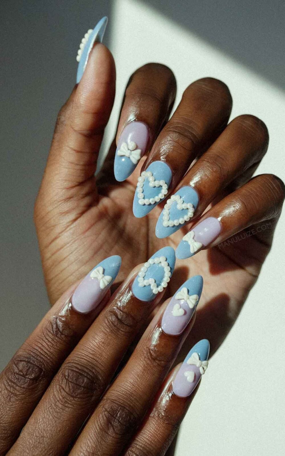 Cute light blue nail art with pearls Cute light blue nail art with pearls