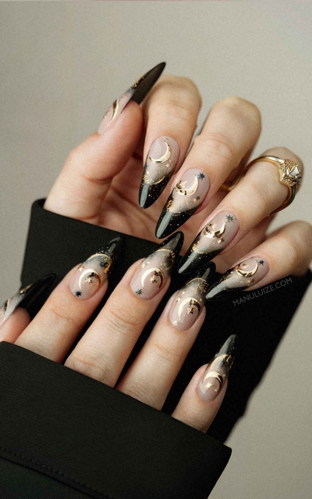 Nude and black nails with witchy nail art Nude and black nails with witchy nail art