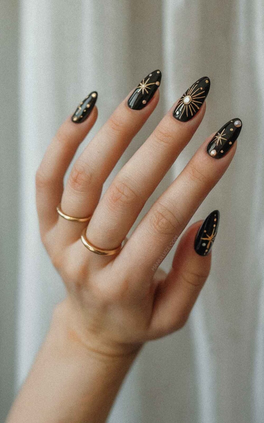 Black and gold witchy nail art