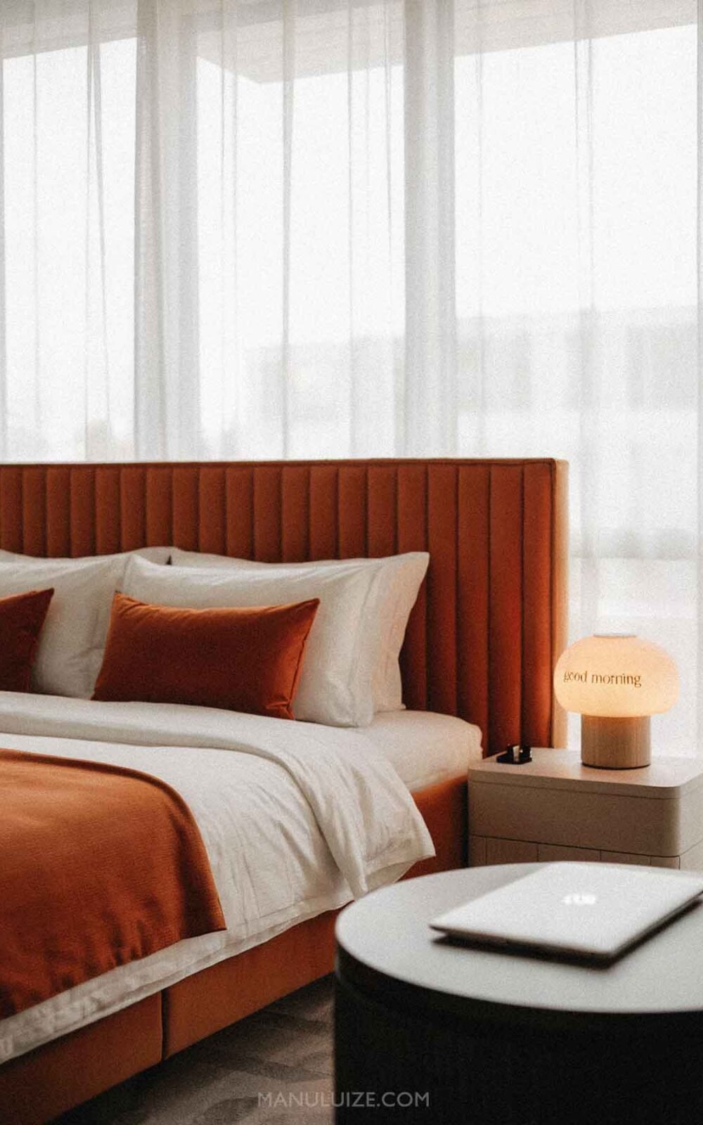 Modern burnt orange bedroom interior