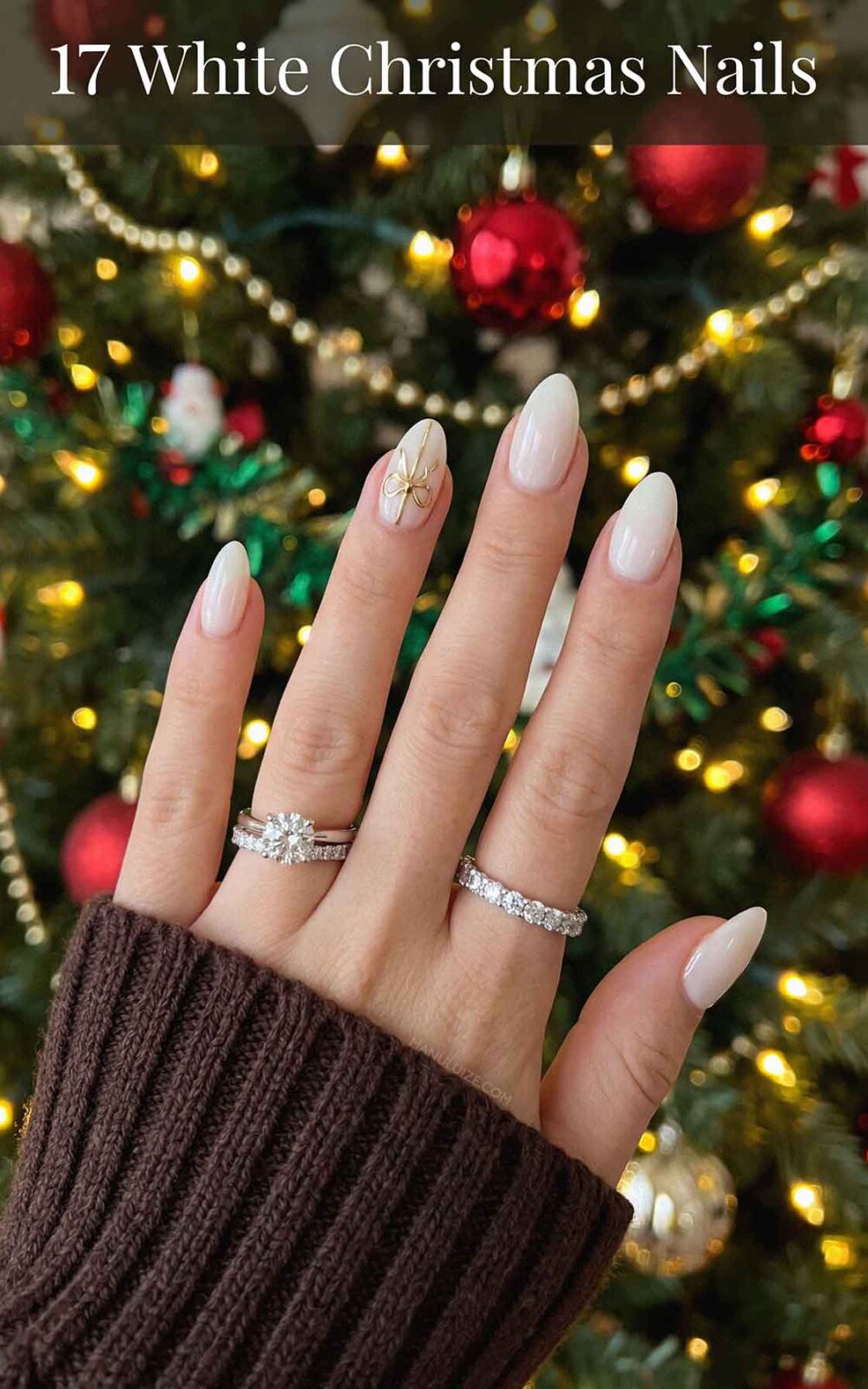 White manicure with gold bow White manicure with gold bow